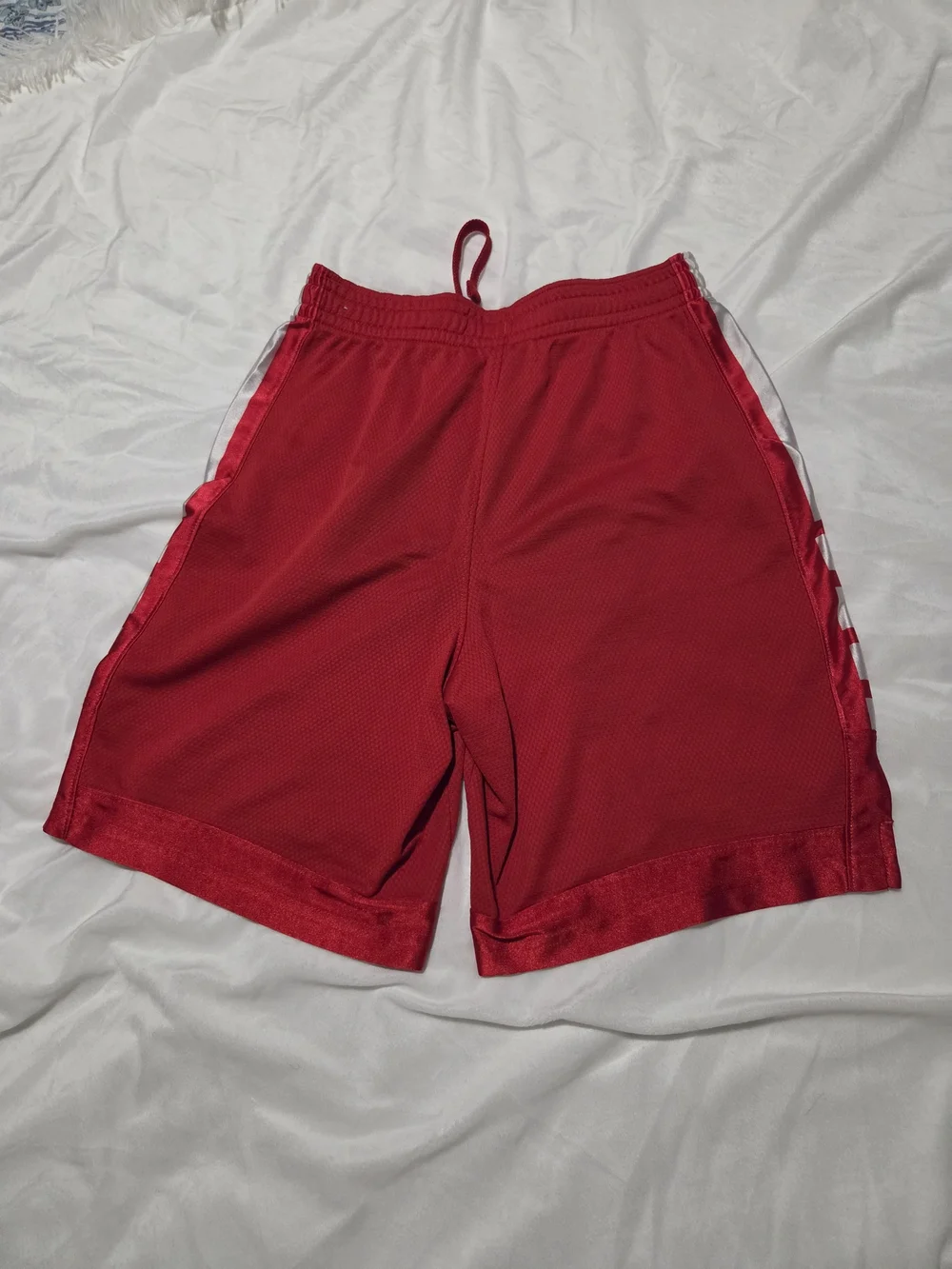 Nike Red Mesh Athletic Shorts with White Swoosh and Side Panels
